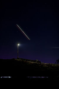 Firework display in sky at night