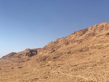 Scenic view of mountains against clear blue sky