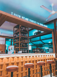 Empty chairs and tables in restaurant