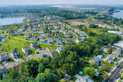 High angle view of trees and buildings in city