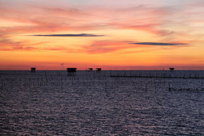 Scenic view of sea against orange sky