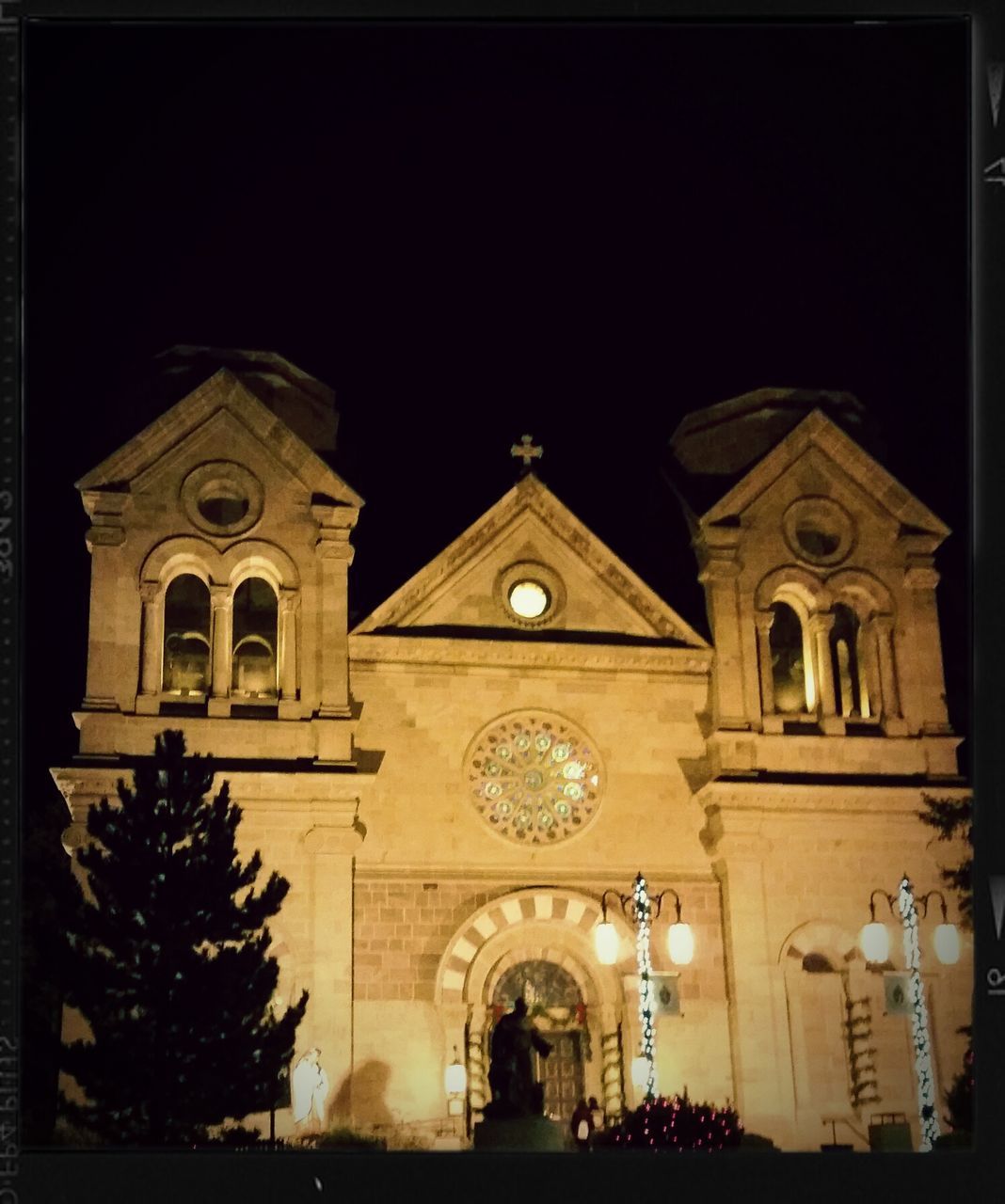 place of worship, religion, architecture, church, building exterior, spirituality, built structure, low angle view, cathedral, facade, arch, clear sky, cross, night, auto post production filter, illuminated, sky, transfer print