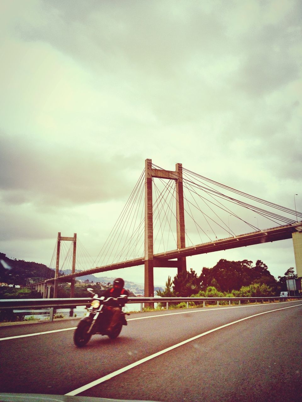 transportation, bridge - man made structure, architecture, built structure, connection, sky, cloud - sky, engineering, suspension bridge, cloudy, car, road, land vehicle, city, cloud, travel, mode of transport, bridge, travel destinations, famous place