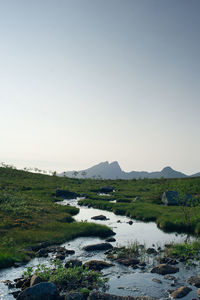 Scenic view of landscape with mountain range in background