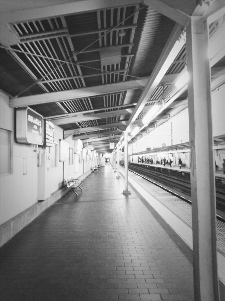 indoors, architecture, ceiling, built structure, the way forward, transportation, diminishing perspective, incidental people, empty, corridor, railroad station platform, railroad station, flooring, illuminated, vanishing point, interior, public transportation, architectural column, subway station, transportation building - type of building