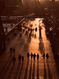 High angle view of people walking on street in city