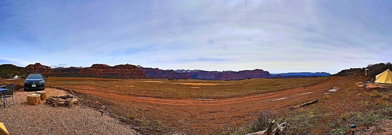 sky, environment, cloud - sky, scenics - nature, mountain, landscape, nature, beauty in nature, non-urban scene, mode of transportation, day, land vehicle, motor vehicle, transportation, land, tranquility, tranquil scene, car, outdoors, travel, no people, climate, arid climate