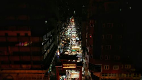 Illuminated market in city at night