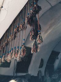 Low angle view of decoration hanging from wall