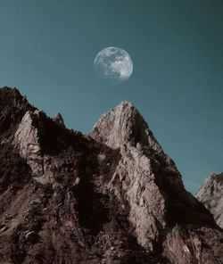 Low angle view of rock formation against sky