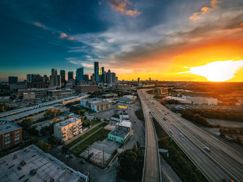 High angle view of city at sunset
