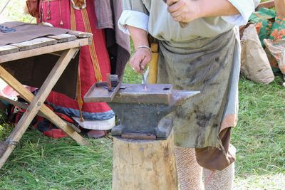 Low section of man working on field