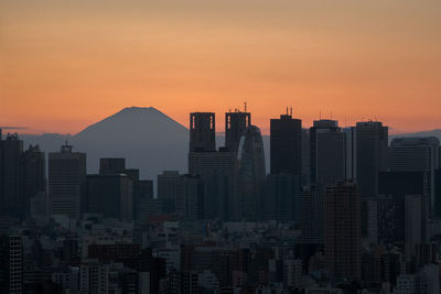 View of cityscape against sky during sunset