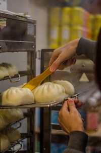 Midsection of man preparing food