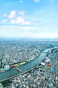 High angle view of buildings in city against sky