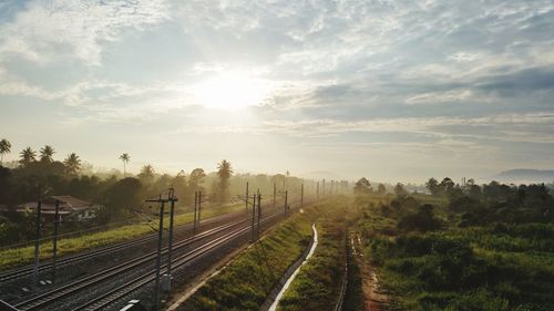 High angle view of railroad tracks against sky during sunset