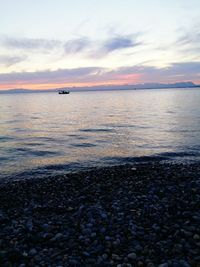 Scenic view of sea against cloudy sky