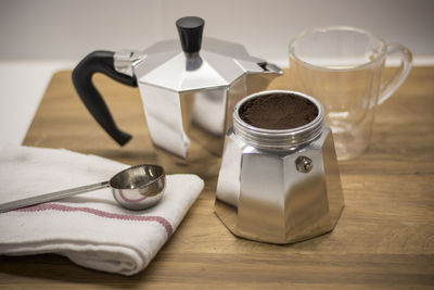 Close-up of coffee maker on table