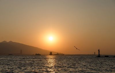 Scenic view of sea against sky during sunset