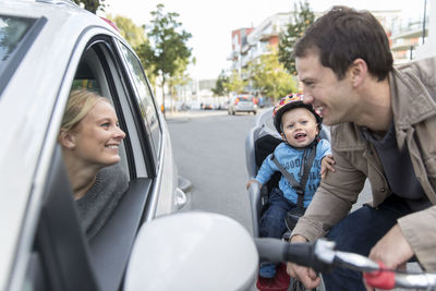 Portrait of father and son in car