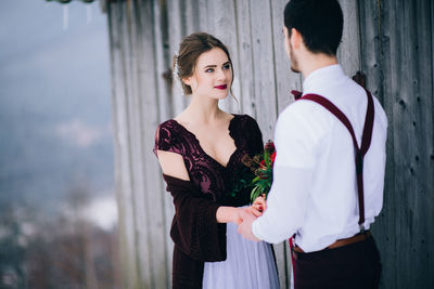 Young couple standing outdoors