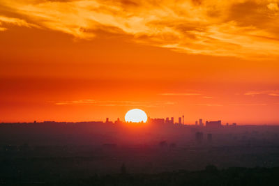 Scenic view of sunset over city
