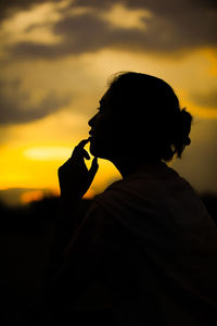 Portrait of silhouette man against sky during sunset