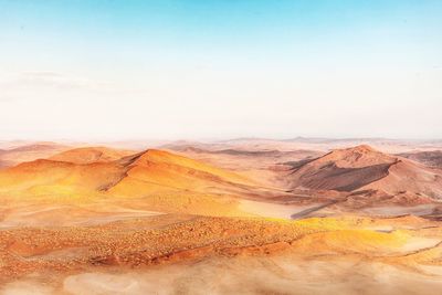 Scenic view of desert against clear sky