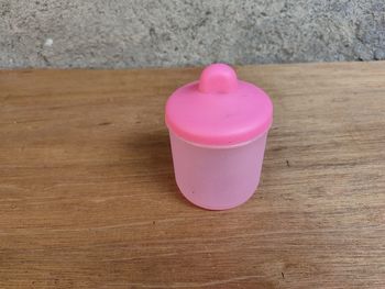 High angle view of heart shape on pink table