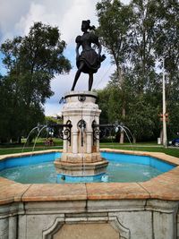 Statue in swimming pool