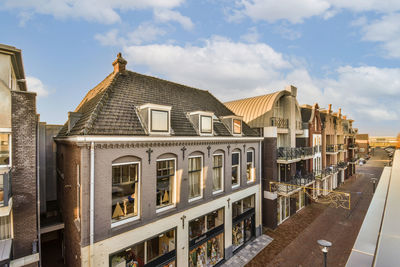 Buildings in city against sky