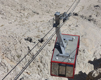 High angle view of overhead cable car hanging on cable