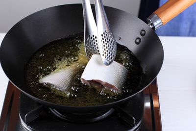 Close-up of utensil in container