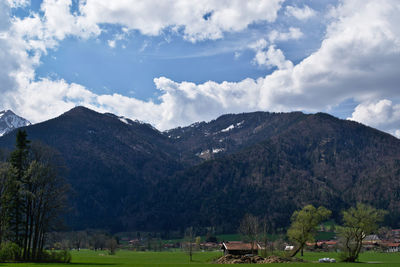 Scenic view of landscape and mountains against sky