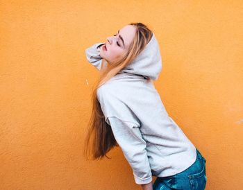 High angle view of woman by wall