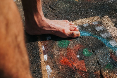 Low section of man standing on floor