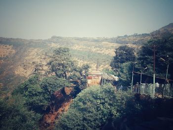 High angle view of trees and buildings against sky