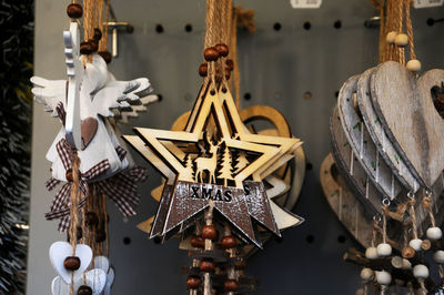 Close-up of christmas decorations hanging at market stall