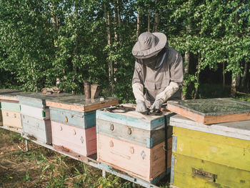 Rear view of man working on field