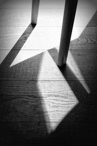 High angle view of shadow on hardwood floor