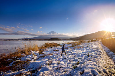 Scenic view of landscape against sky during winter