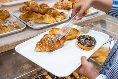 Cropped hand preparing food