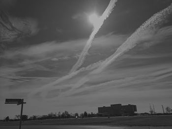 Low angle view of vapor trails in sky