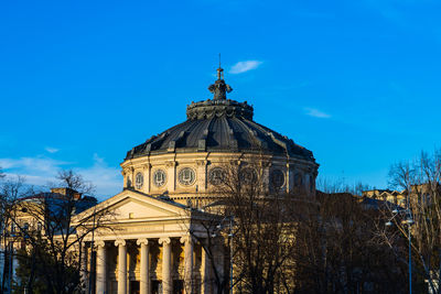 Low angle view of building against blue sky