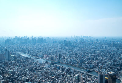 High angle view of city buildings against sky