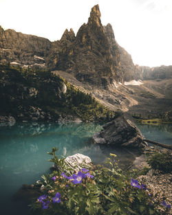 Scenic view of lake against cloudy sky