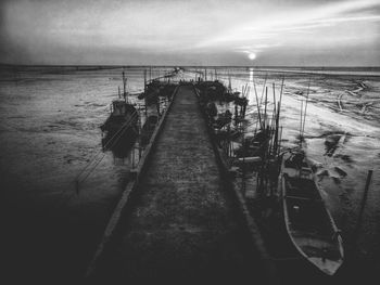 Pier over sea against sky