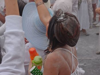 Rear view of people walking outdoors