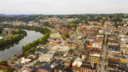 High angle view of river amidst buildings in city