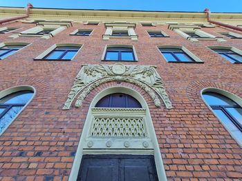 Low angle view of building against blue sky